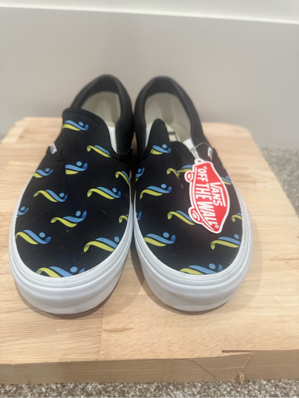 Vans Woman’s Slip-On Sneakers in Black with Blue & Lime Wave Pattern